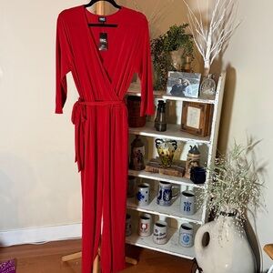 NWT I.N.C. LPBeautiful red wide leg jumpsuit. Wrap top,elastic waist,belt.Flowy!